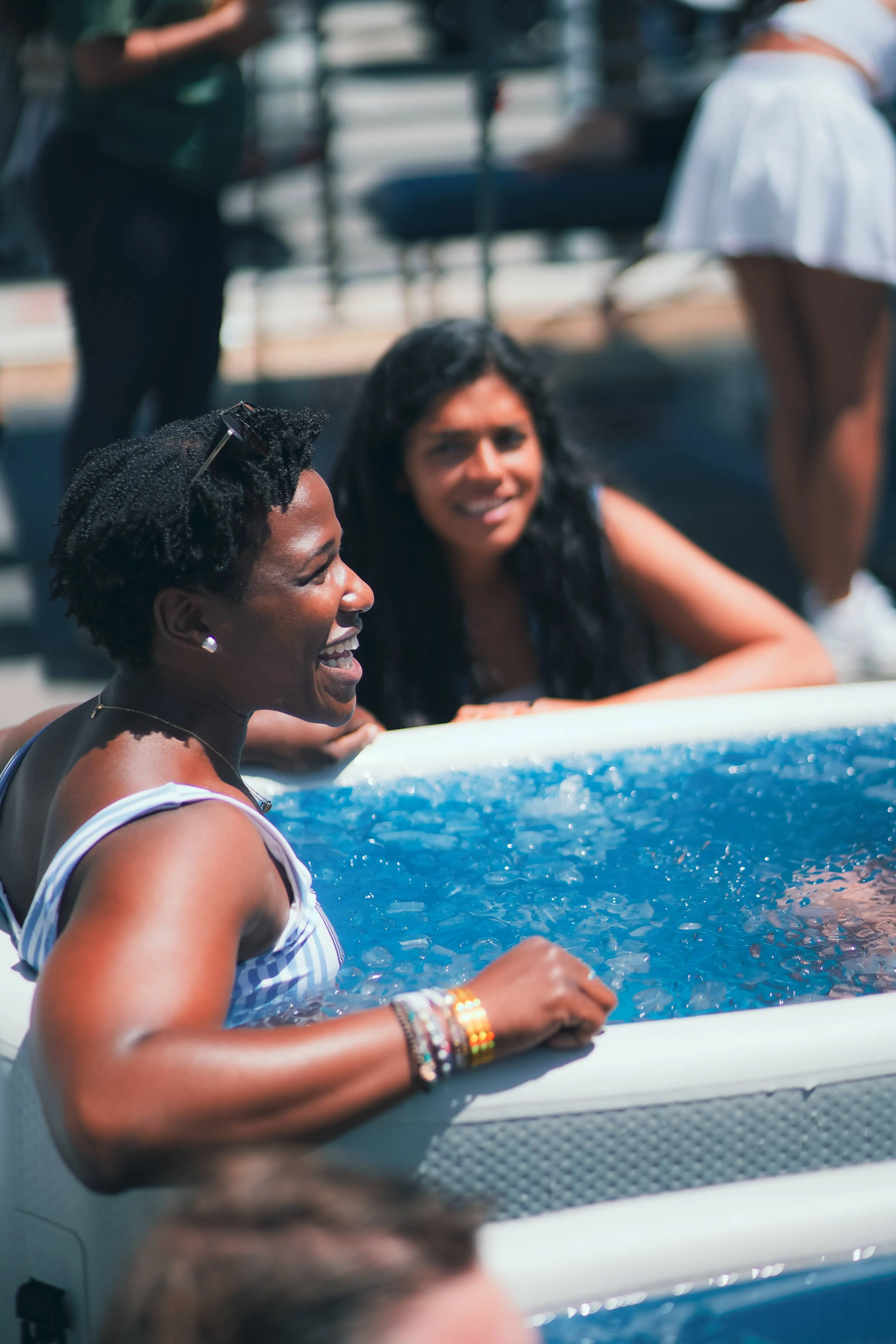 People enjoying a pool event
